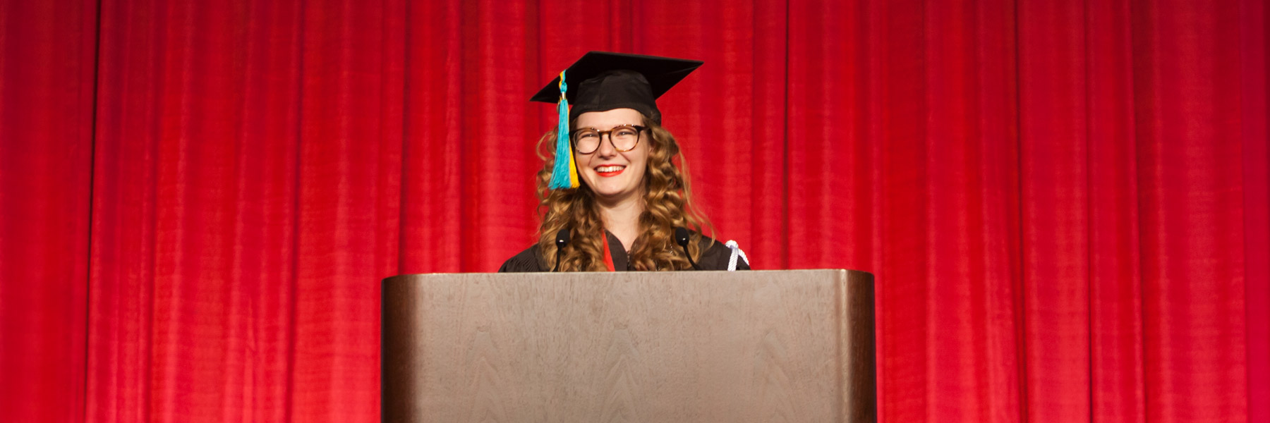 An honors student addresses the commencement audience.