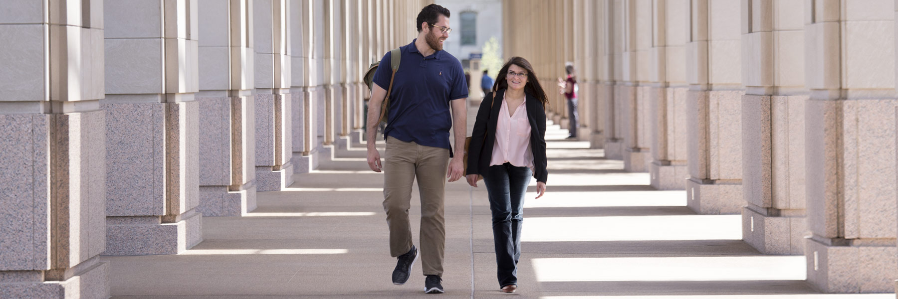 Two grad students walk together from the Indiana statehouse.