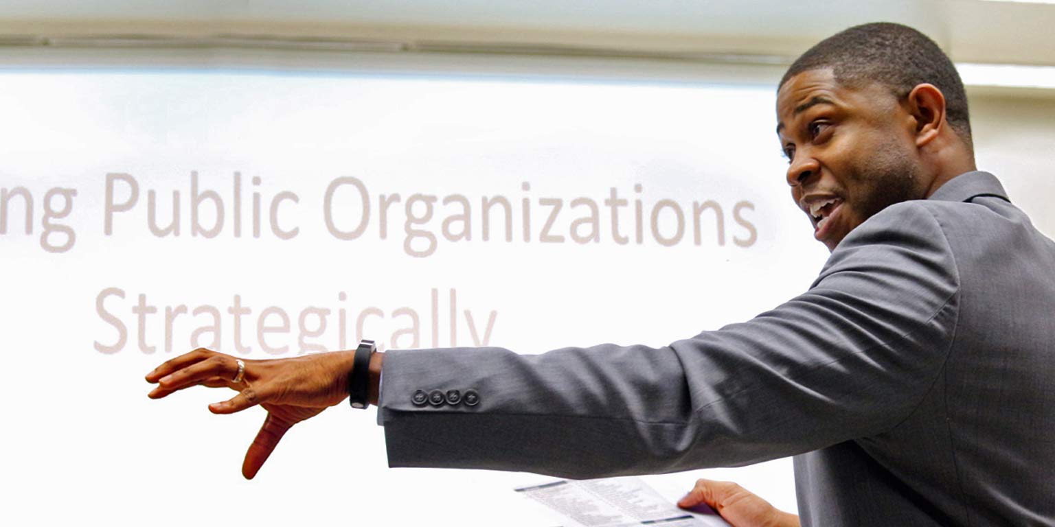 A leadership program participant explains a point. 