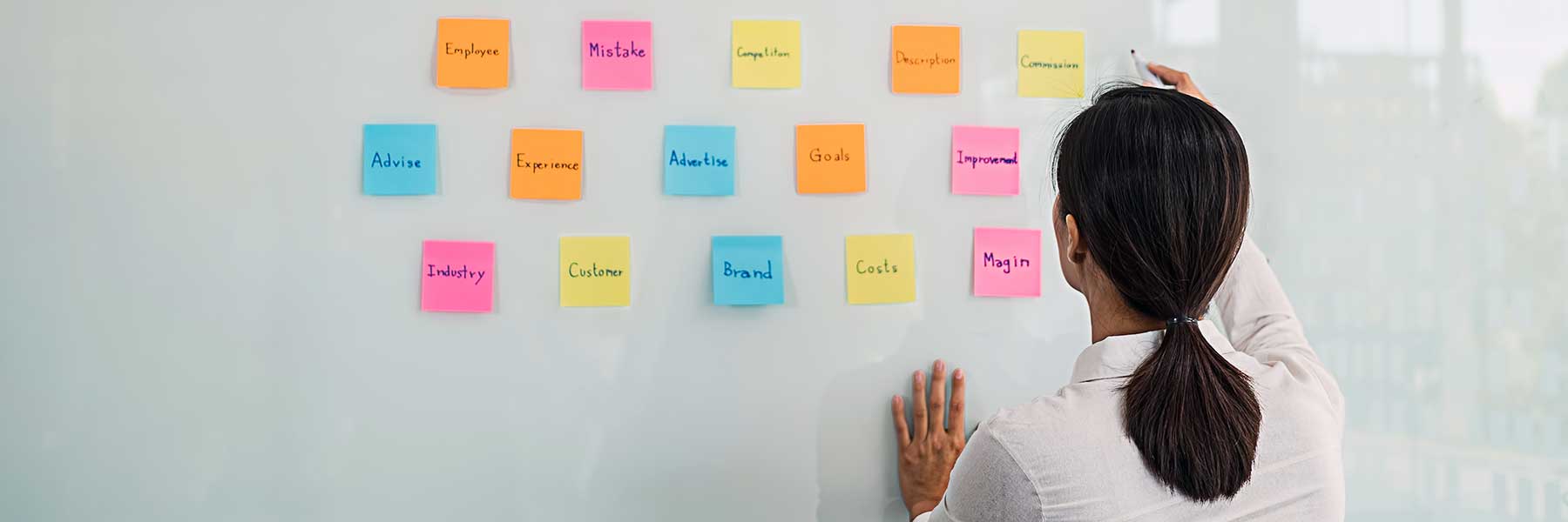 Nonprofit manager writing on white board