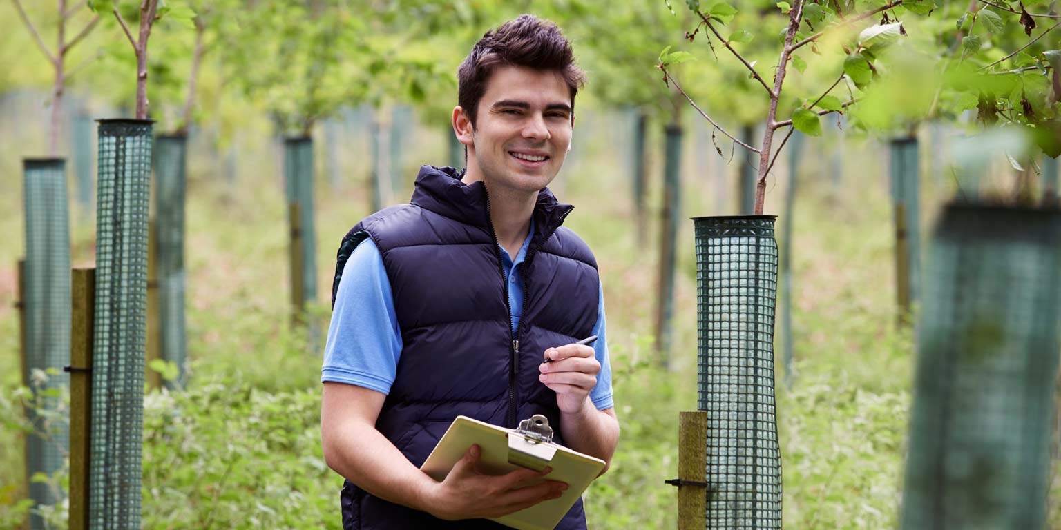 SPEA student takes project notes outdoors.